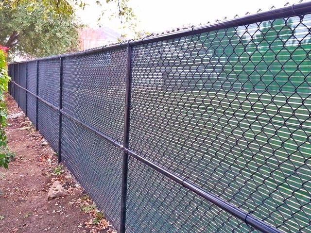 Black Chain Link Fence with Green Windscreen