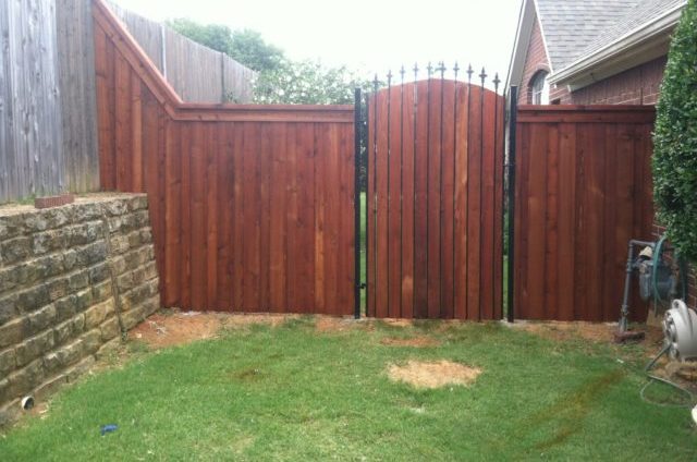 wood fence iron gate