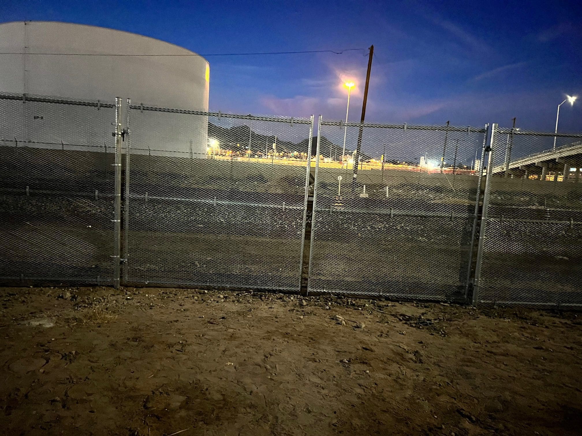 nighttime chain link fence