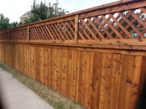 Lattice work on top of wood fence